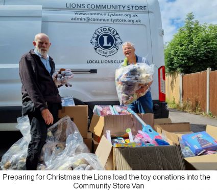Preparing for Christmas the Lions load the Community Store van with the toy donations from Hartswood Films