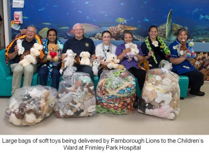 Farnborough Lions pictured with the nurses during the delivery of soft toys to Frimley Park Hospital Children's Ward