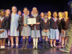 St Bernadette's Choir smiling proudly duringthe awards ceremony St Bernadette's Choir smiling proudly duringthe awards ceremony