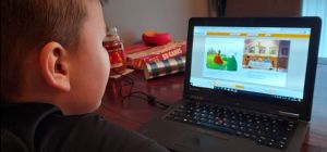 One of hundreds of Farnborough school pupils using a donated laptop for home learning