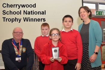 Team Cherry on Top pictured with Farnborough Lions President Steve Boast and Mrs N Lynch at the ROAR 2023 Prizegiving